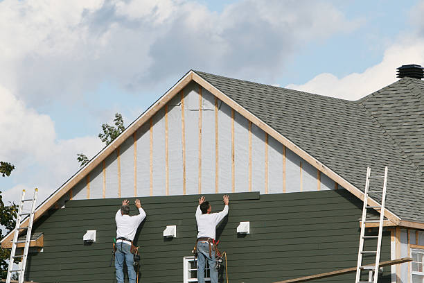 Professional Storm Damage Siding Repair technician working in Winfield, PA